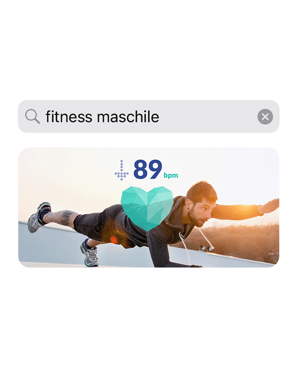 Uno screenshot dell’app che mostra la query di ricerca “men’s fitness” con sotto l’immagine di un uomo che si allena.