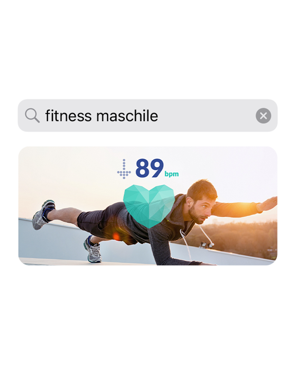 Uno screenshot dell’app che mostra la query di ricerca “fitness maschile” con sotto l’immagine di un uomo che si allena.