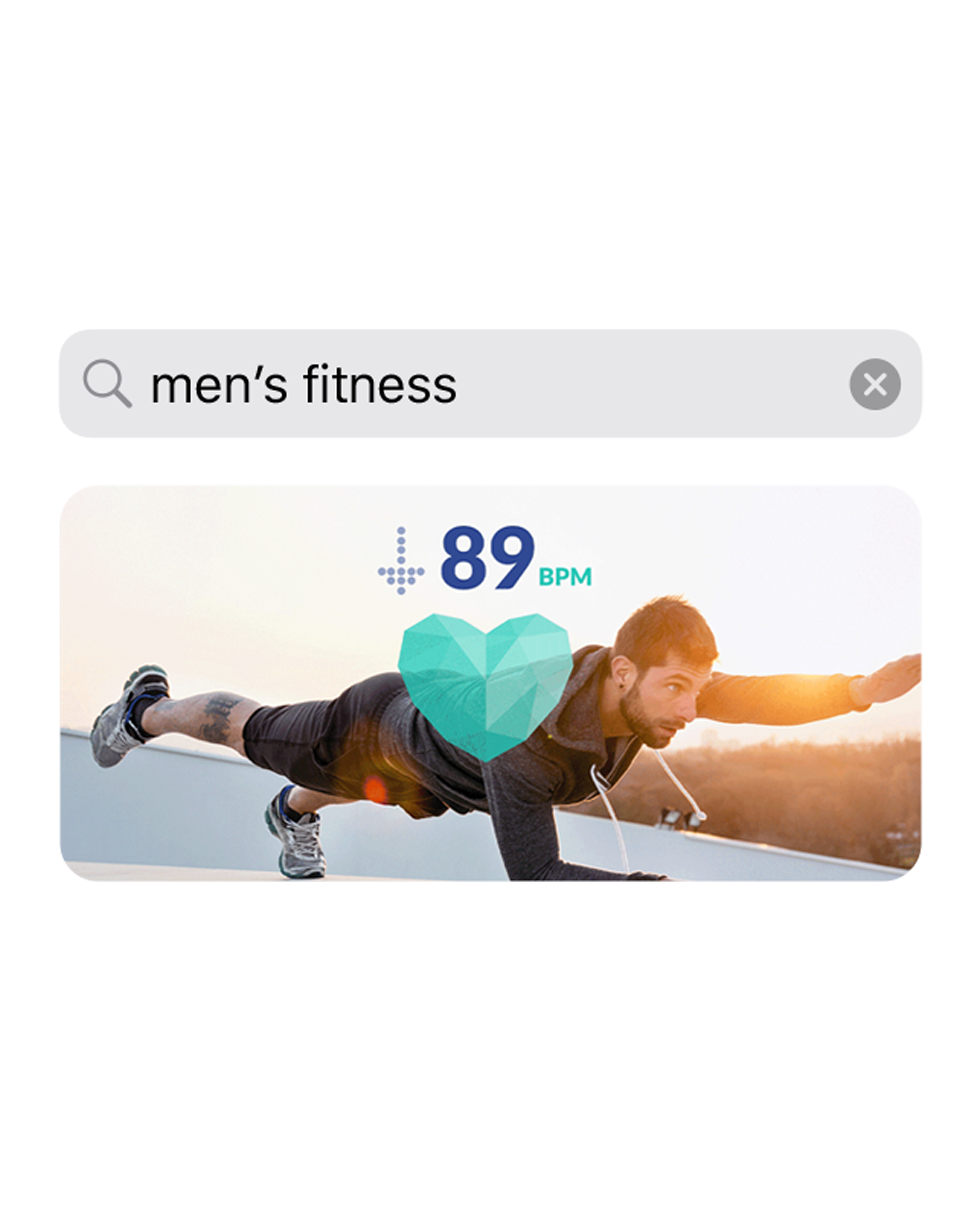 An app screenshot showing the search query "men's fitness" with an image of a man exercising below it.